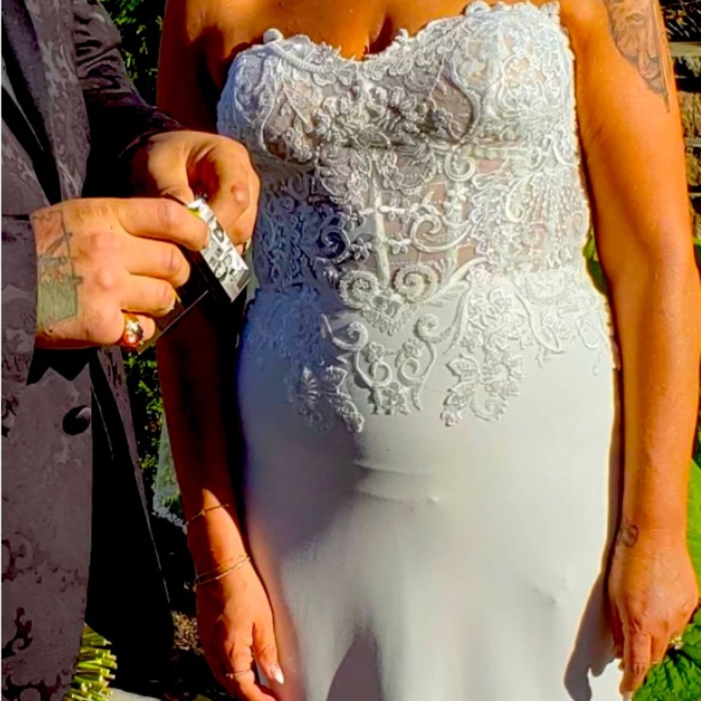 Gorgeous designer wedding gown with veil only worn once